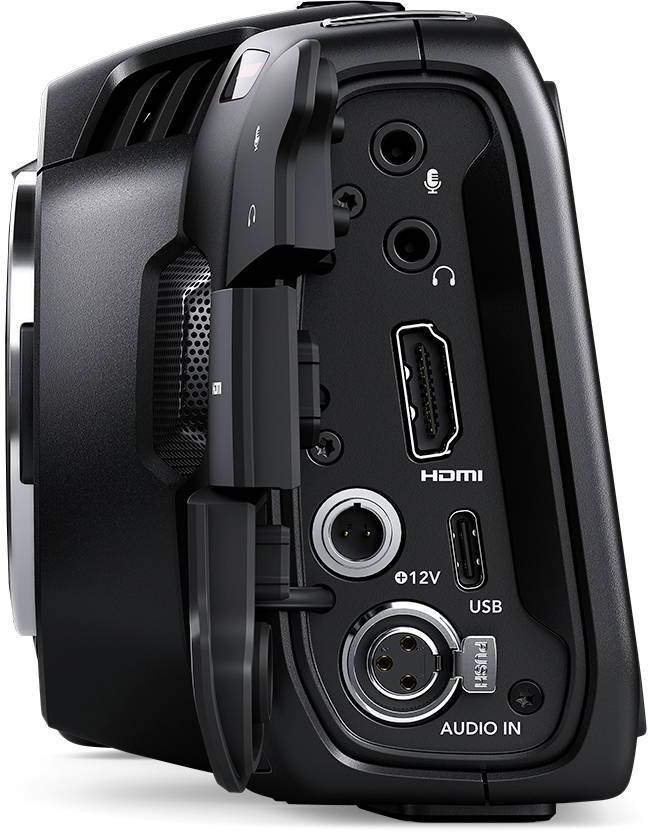 De zijaanzicht van een zwarte camera toont verschillende aansluitingen, waaronder HDMI, USB, Audio en stroomvoorziening.