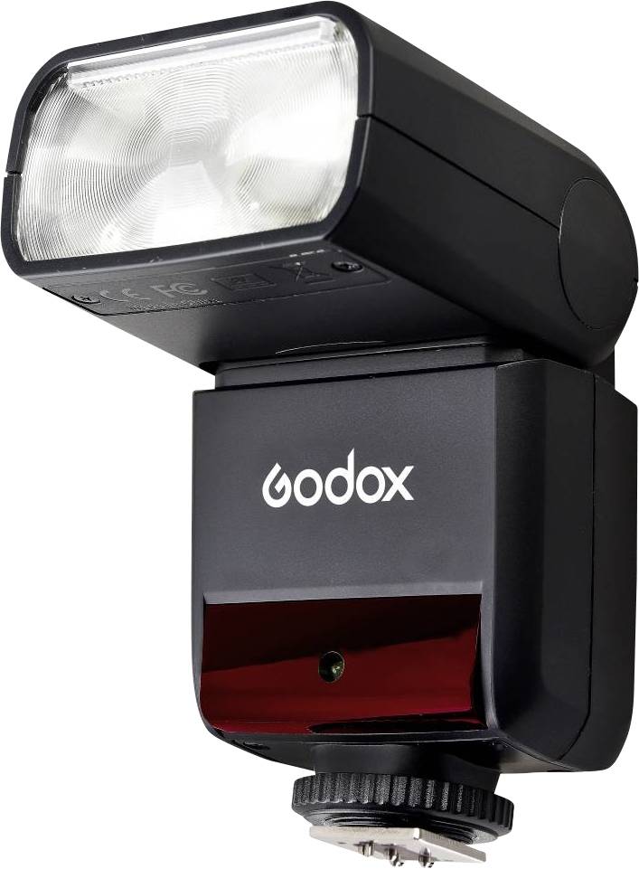 Een zwarte externe flitser met het opschrift 'Godox'. Ideaal voor fotografie onder slechte lichtomstandigheden.