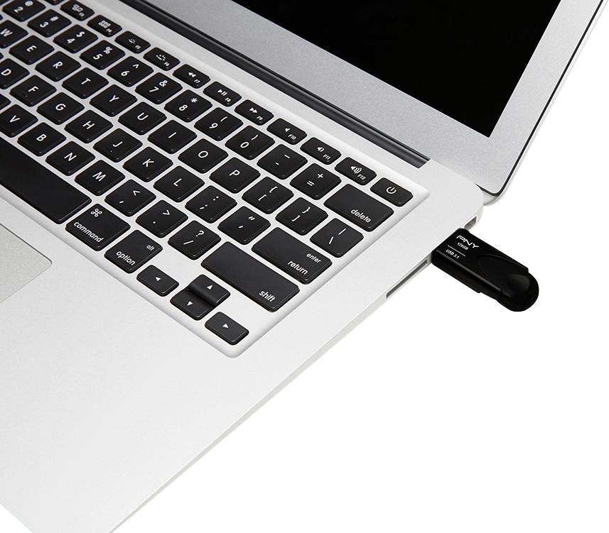 Een laptop met een USB-stick aangesloten aan de rechterkant; het scherm is zwart.