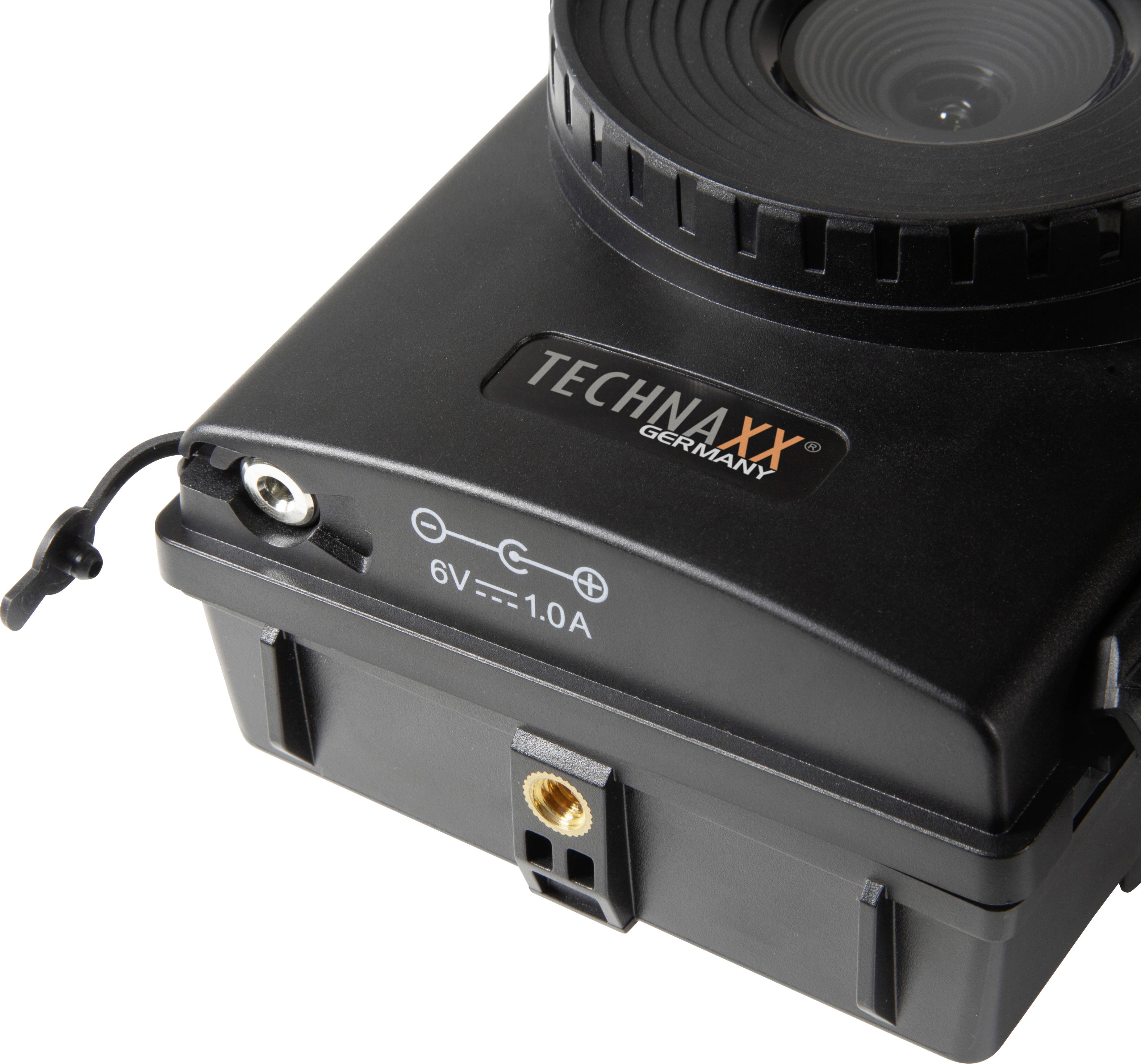 Camera van het merk 'Technaxx Germany', zwart, bevestigd op een bevestigingspunt, met 6V 1.0A aansluiting.