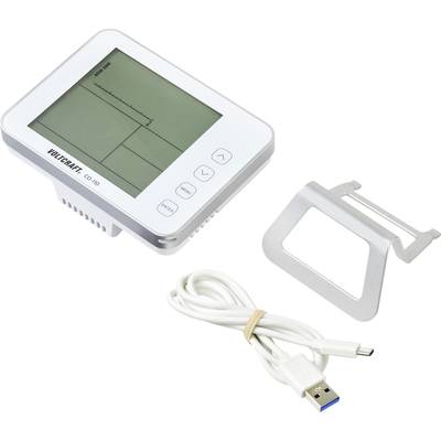 Bloeddrukmeter met digitaal display, USB-kabel en houder. Display toont meetwaarden en bedieningsknoppen.