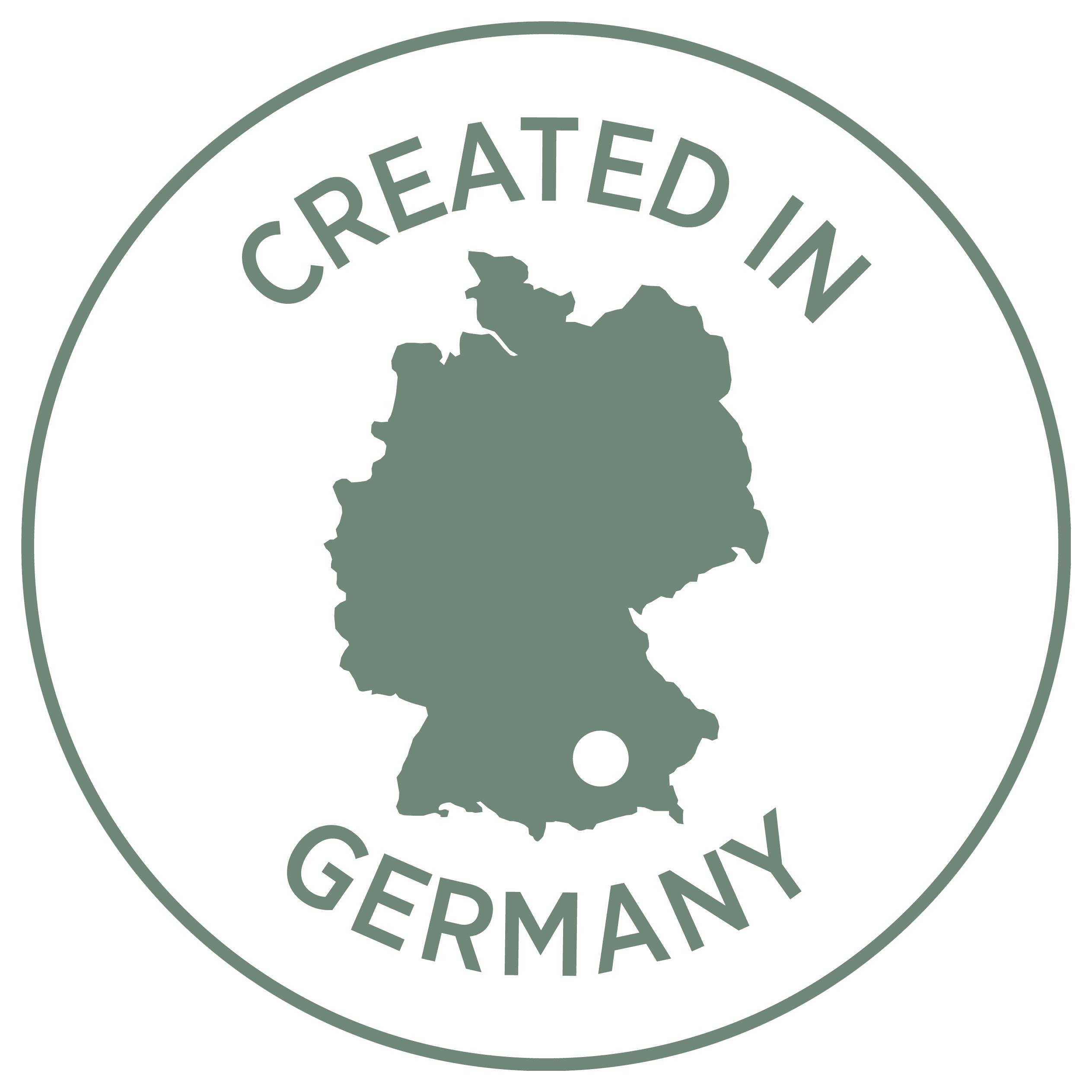 Rond zegel met Duitsland-silhouet en de tekst 'CREATED IN GERMANY'; duidt op een product dat in Duitsland is vervaardigd.