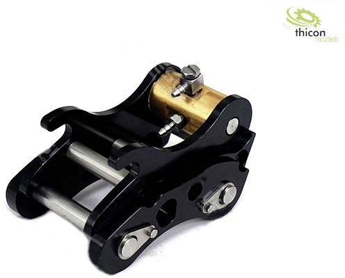 Zwarte miniatuur-kantelkoppeling van metaal met gouden en zilveren details, mogelijk geschikt voor modelbouw of machines.