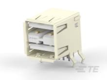 Een rechthoekige, beige stekker met meerdere aansluitingen en aansluitpunten, specifiek geschikt voor elektronische verbindingen.