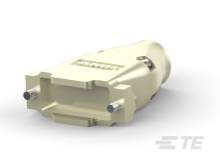 Een crèmekleurige, rechthoekige adaptstekker met metalen pinnen, waarschijnlijk bedoeld voor een elektronische verbinding of kabel.
