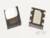 Twee zwarte microchips met meerdere aansluitingen op een lichte ondergrond. Eén chip heeft een witachtige bovenkant.