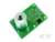Groene printplaat met een cilindrische sensor in het midden en elektronische componenten eromheen.
