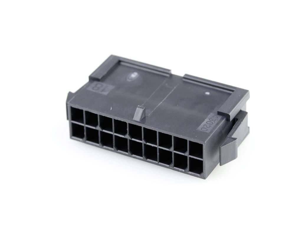 Zwart elektronisch connector-behuizing met meerdere vierkante aansluitingen, bestemd voor verbindingen binnen apparaten.