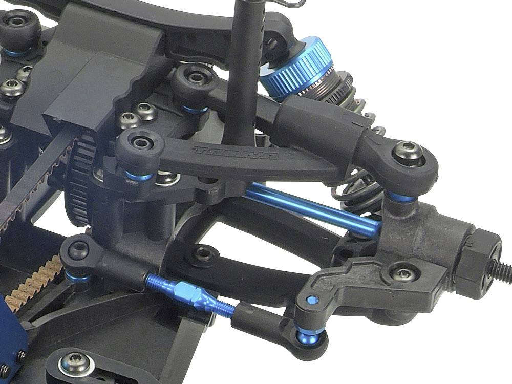 Close-upfoto van een machinedeel met tandwielen en blauwe schroeven, dat een onderdeel van een complex mechanisch systeem toont.