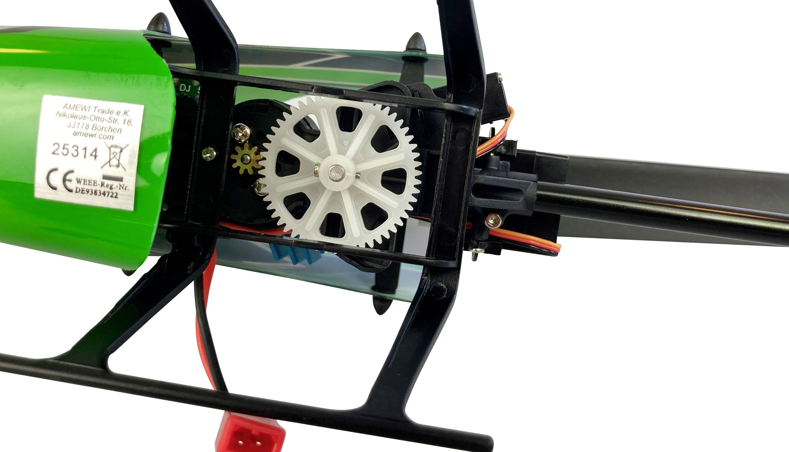 Gedetailleerde close-up van een modelhelikoptermotor met zichtbaar tandwielmechanisme en bedrade accu, gericht op techniek-enthousiastelingen.