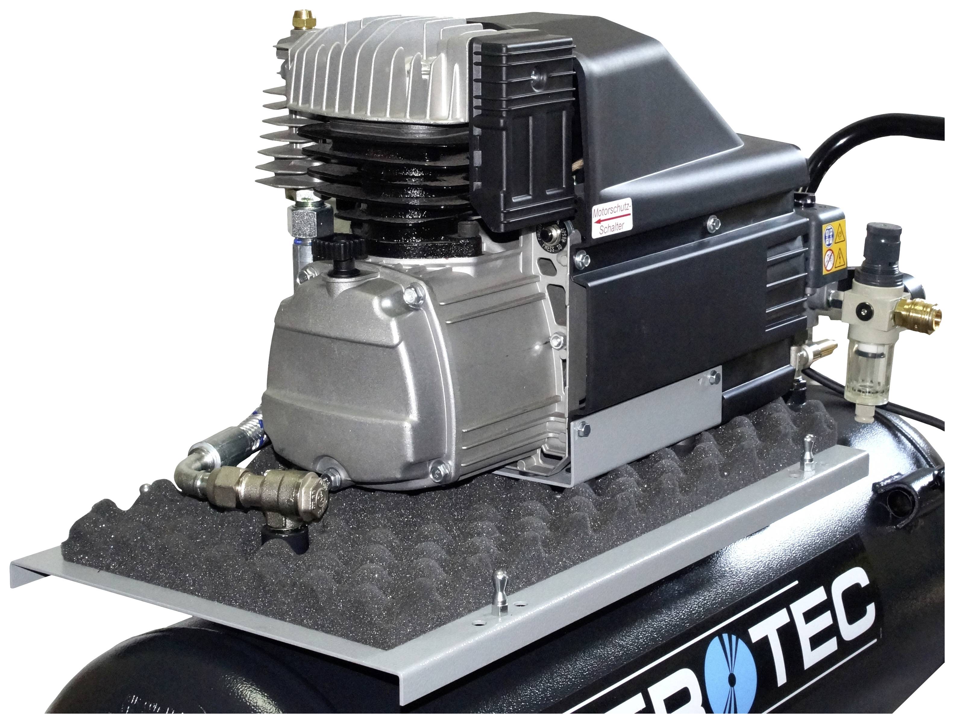 Een luchtcompressor met een zilver en zwart behuizing staat op een schuimstofbasis. Slangen en kleppen zijn aangesloten.