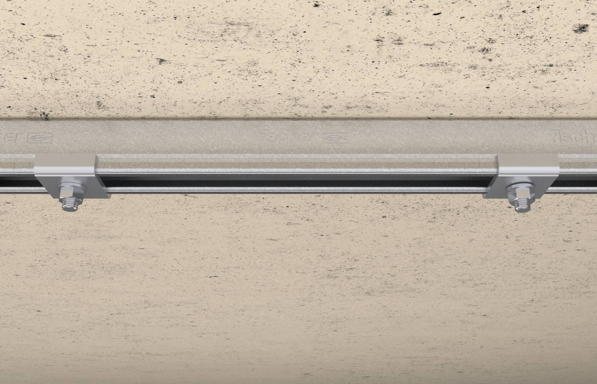 Metalen rail met schroefverbindingen bevestigd aan een betonoppervlak, onderdeel van een bevestigingsconstructie.