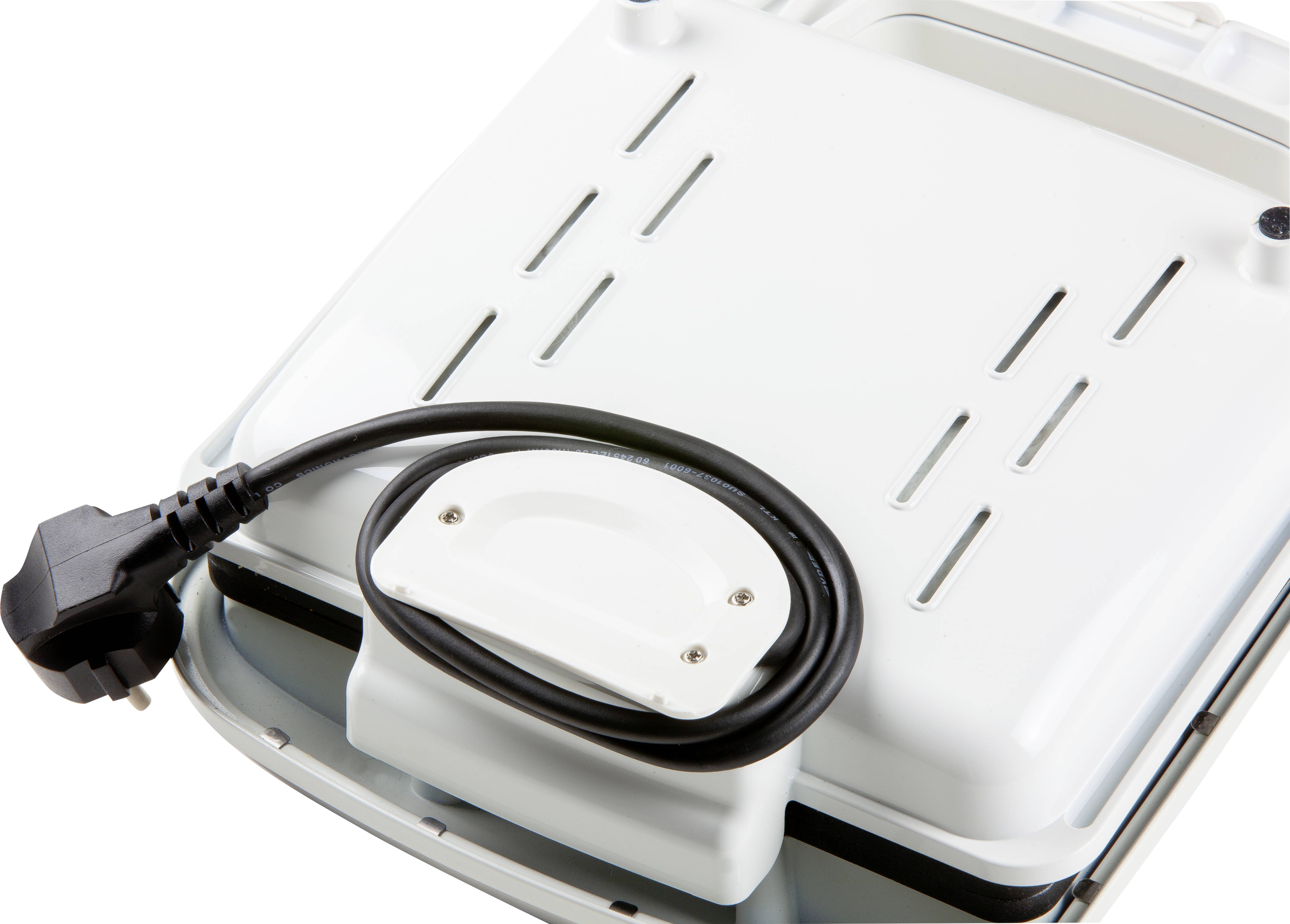 Een wit elektrisch apparaat met een uitneembaar plateau en een zwart netsnoer. Het apparaat staat op een gladde oppervlakte.