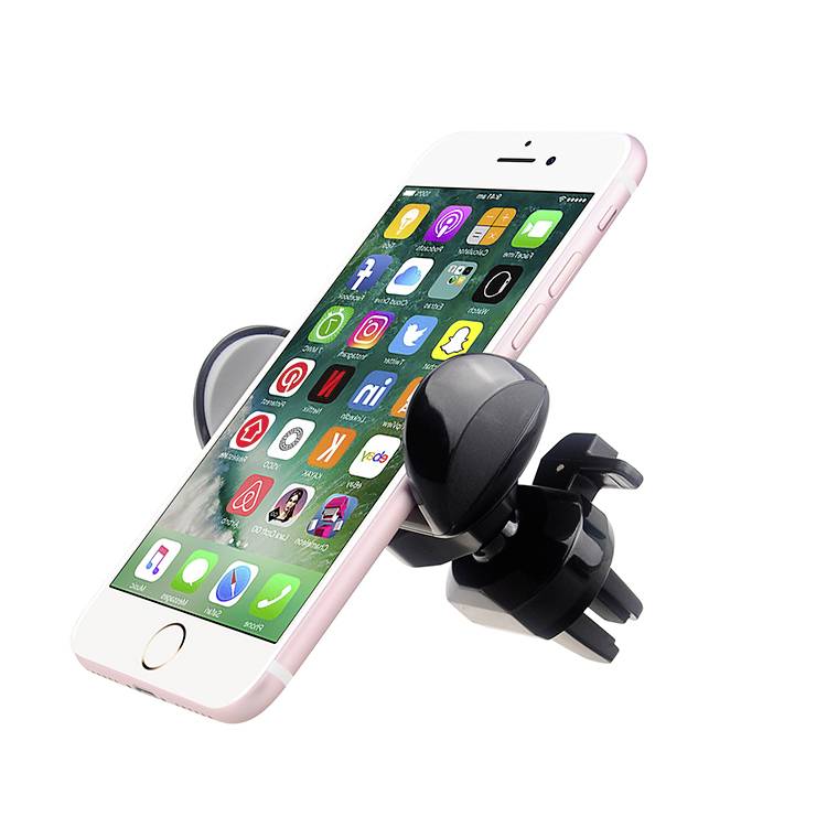 Smartphone in autohouder, toont app-pictogrammen op het scherm. Houder bevestigd aan de verluchtingsgleuf van een voertuig.