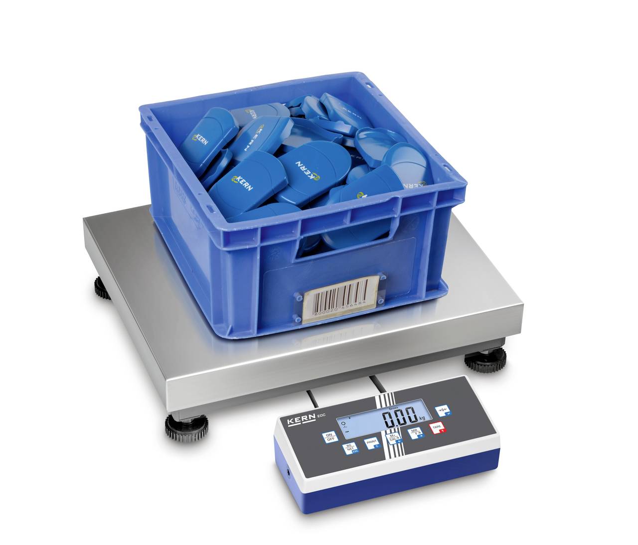 Een blauwe doos met verschillende blauwe voorwerpen staat op een digitale weegschaal. De display toont 0,00.