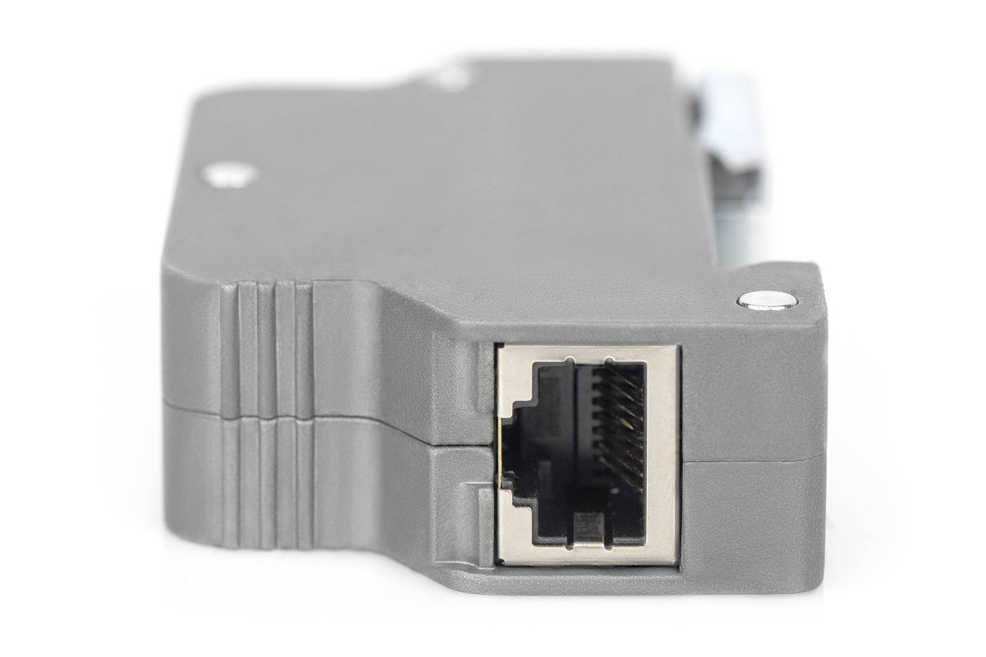 Close-upfoto van een grijze ISDN-adapter met RJ45-aansluiting, gebruikt voor verbinding tussen telefoonnetwerk en apparaten.