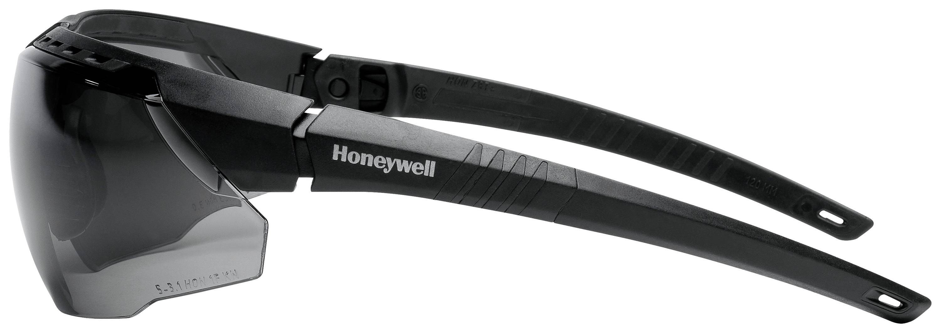 Veiligheidsbril van zwart kunststof met getinte glazen, zijdelingse beschermkap en matte pootjes. Merk: Honeywell.