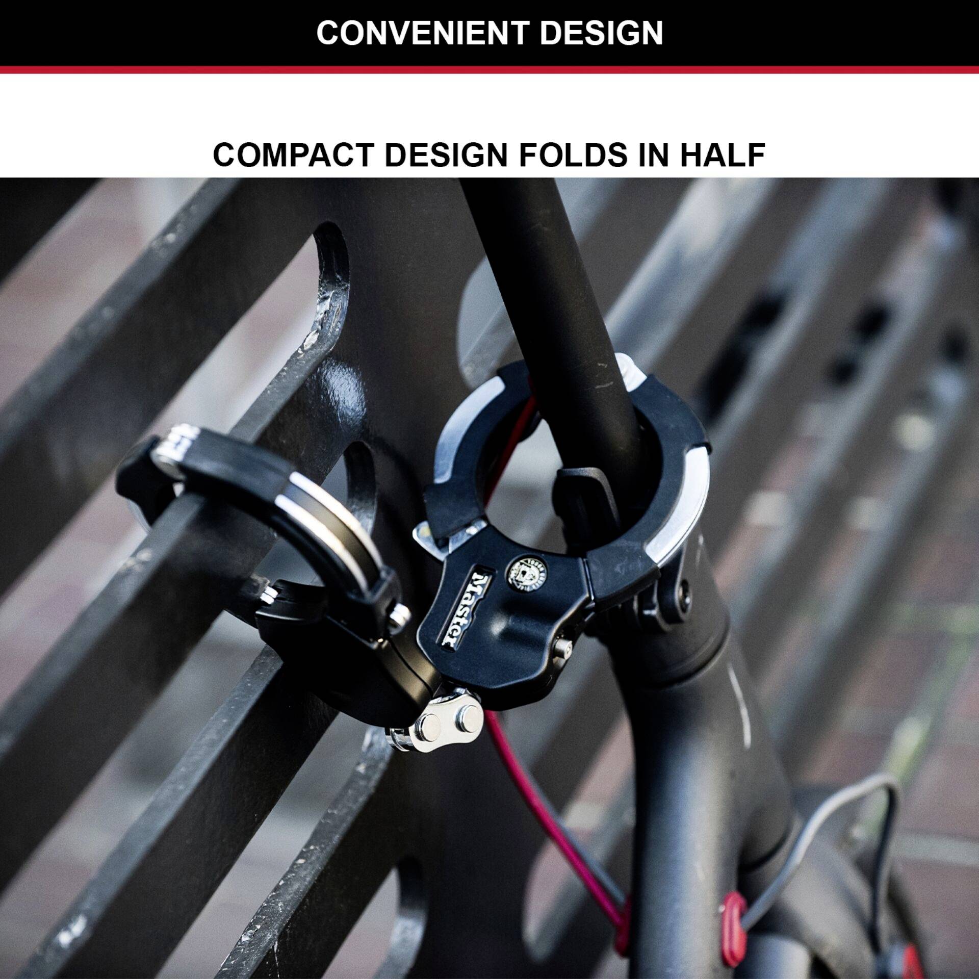 Stuur met een compact ontwerp dat in de helft kan worden ingeklapt. Gefotografeerd voor een metalen hek.