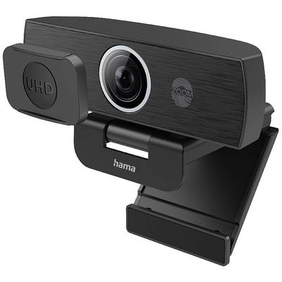 Webcam met UHD-capaciteit en zoomfunctie, bevestigd aan een monitor. Hij is zwart en draagt het logo van een bekende fabrikant.