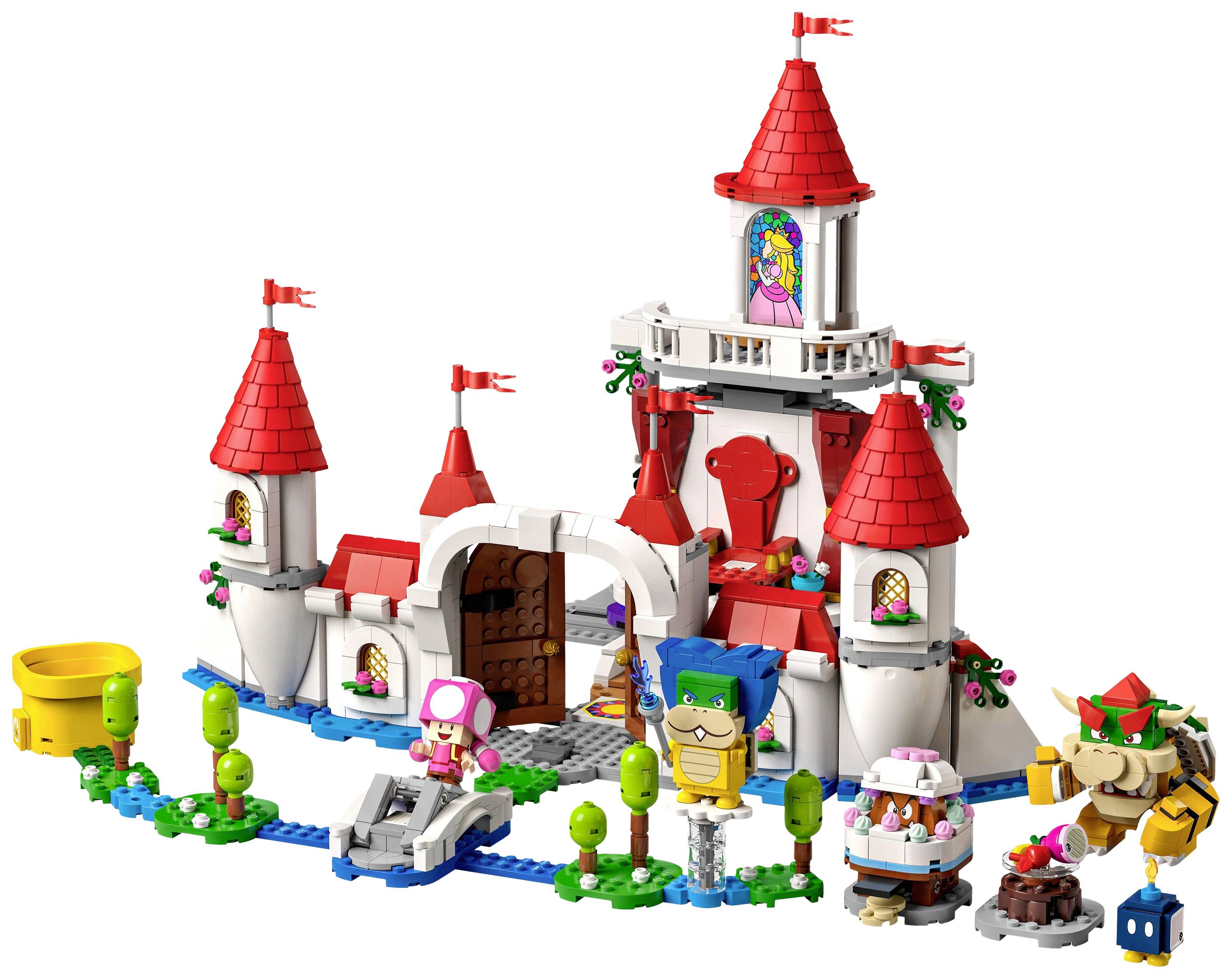 Lego-bouwset van een kleurrijk kasteel met torens en figuren, waaronder een paddenstoelkop-personage en een blauwe tank. Speelse scène.