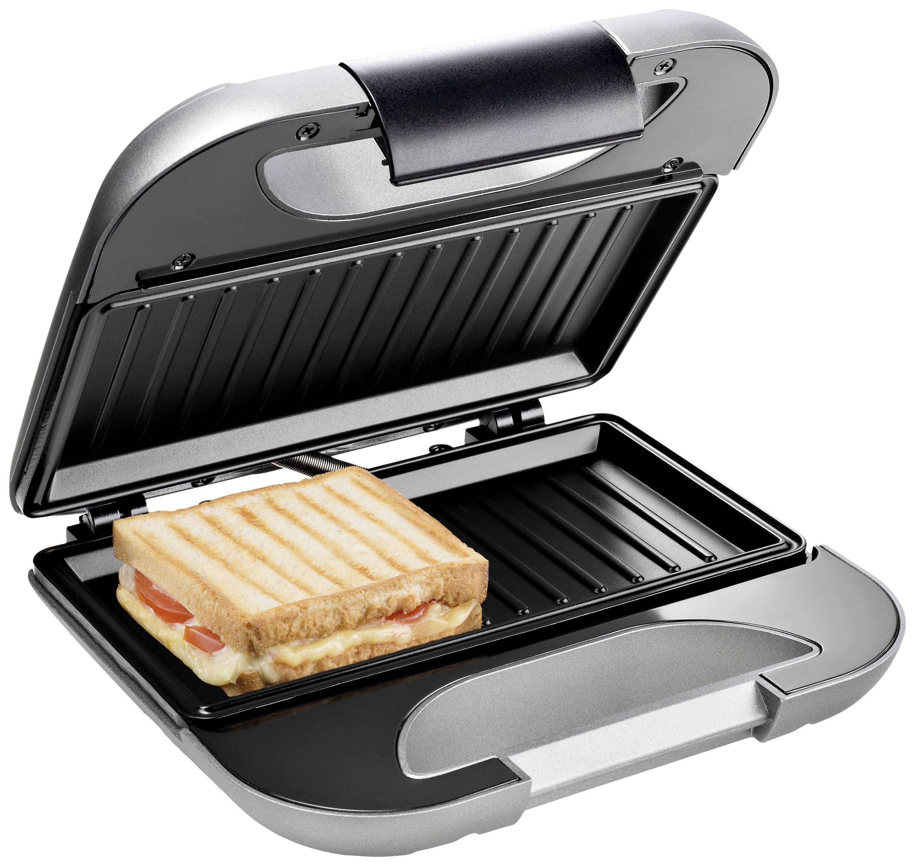 Een geopende tosti-ijzer met een tosti van toast, kaas en tomaten op de grillplaat.