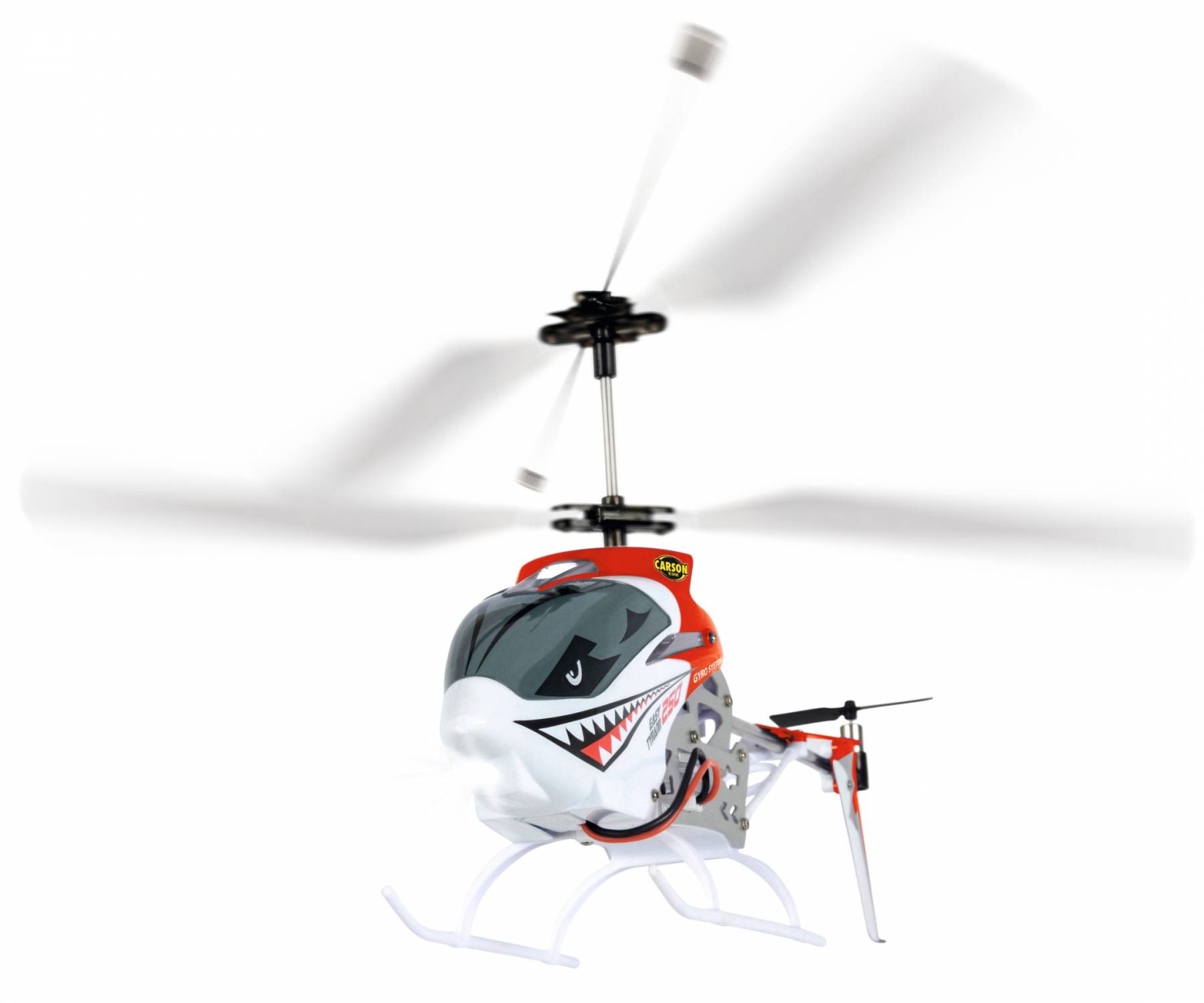 Een speelgoed-helikopter met een haaiensnuit en rood-witte beschildering vliegt, met roterende rotorbladen zichtbaar.