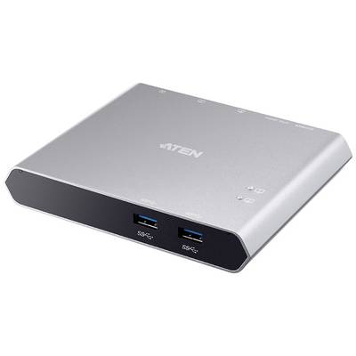 Een zilveren, rechthoekig apparaat met twee USB-poorten aan de voorkant en meerdere aansluitingen bovenop, waarschijnlijk een hub of switch.