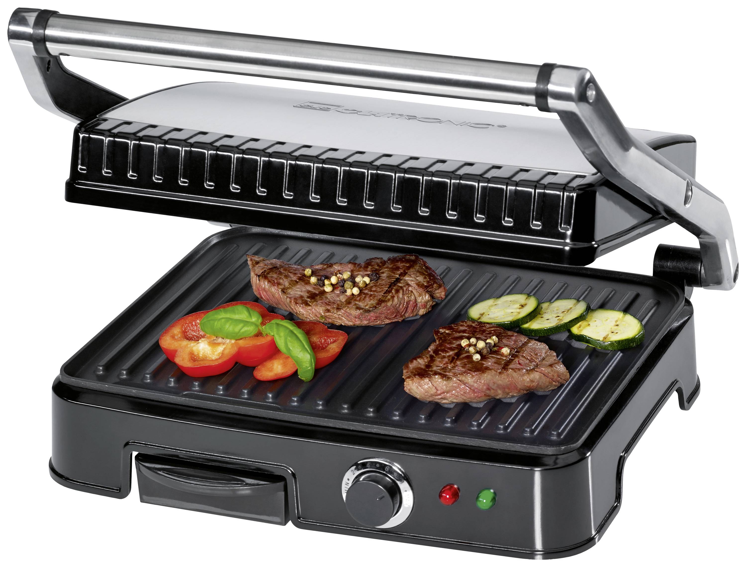 Open contactgrill met gegrilde steaks, tomaten, courgette en basilicum op de grillplaten. Draaiknop en lampjes aan de voorkant.