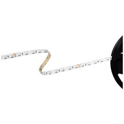 Een LED-strip is gedeeltelijk afgerold van een zwarte spoel. De strip toont kleine LED-lampjes en kopercontacten.