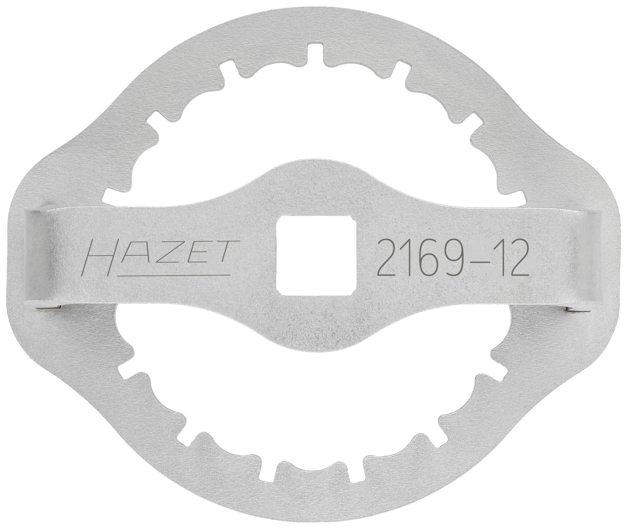 Een zilveren metalen gereedschap, gemarkeerd met 'HAZET' en '2169-12'. Het heeft een tandwiel-achtige rand en een vierkante opening in het midden.