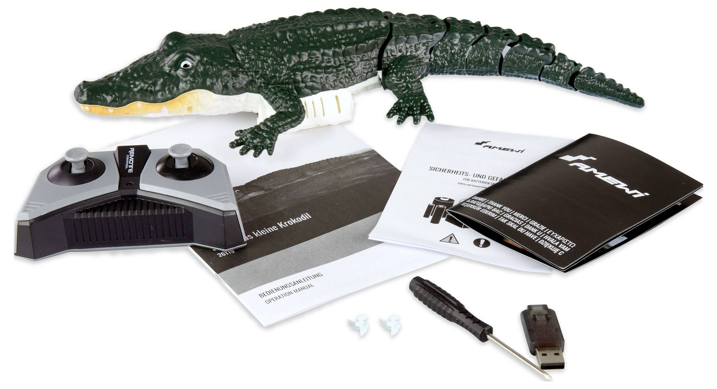 Afstandsbediend krokodil-speelgoed met afstandsbediening, handleiding, USB-stick, schroevendraaier en reserveonderdelen. Ideaal voor kinderen.