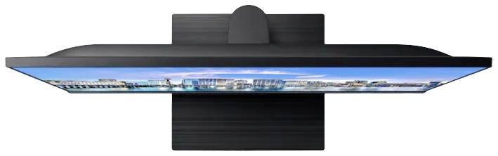 Een moderne televisie wordt van opzij getoond, met een smal frame en een scherp beeld van een stadslandschap op het scherm.