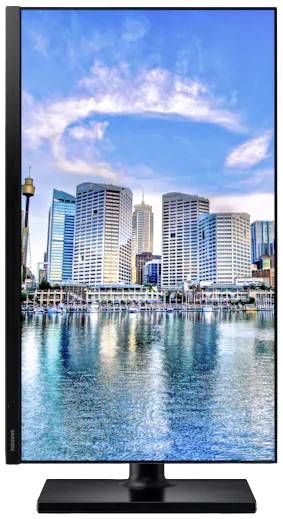 Wolkenkrabbers met weerspiegelende gevels aan het water, daarboven een blauwe lucht met hier en daar enkele wolken. Stedelijk stadslandschap met moderne architectuur.