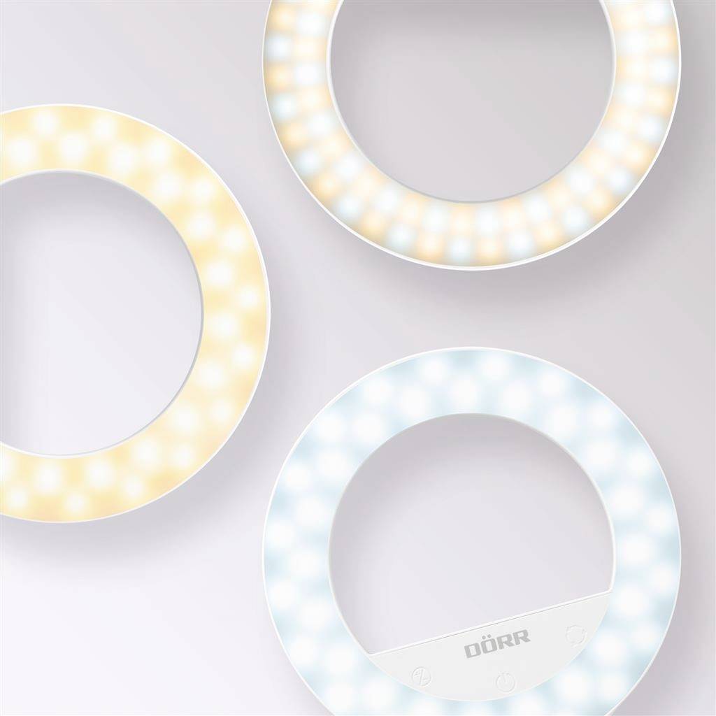 Drie ronde selfie-lampen met verschillende kleurtemperaturen op een lichte achtergrond. Bovenste ringen tonen warmwit en koudwit, onderste ring heeft blekere kleuren en een DÖRR-markering.