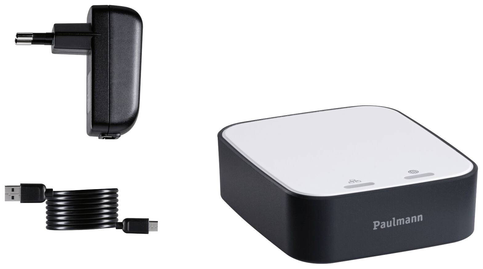 Een witte adapter met zwarte rand, USB-kabel en stekker ernaast. Apparaat van 'Paulmann', mogelijk voor verlichting.