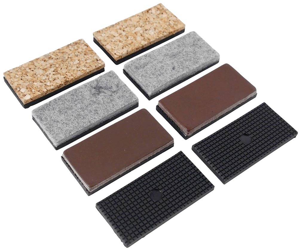 Vierkante onderzetters voor meubels in verschillende materialen en kleuren, gerangschikt in twee rijen. Gebruikt ter bescherming van vloeren.