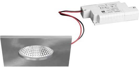 Een witte elektronische sensor met twee draden bevindt zich rechtsboven. Linksonder bevindt zich een gestructureerd oppervlak.