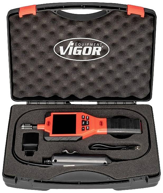 Een zwarte koffer met schuimvoering bevat een rood diagnostisch apparaat met toebehoren. Op de koffer staat het logo 'Vigor Equipment'.