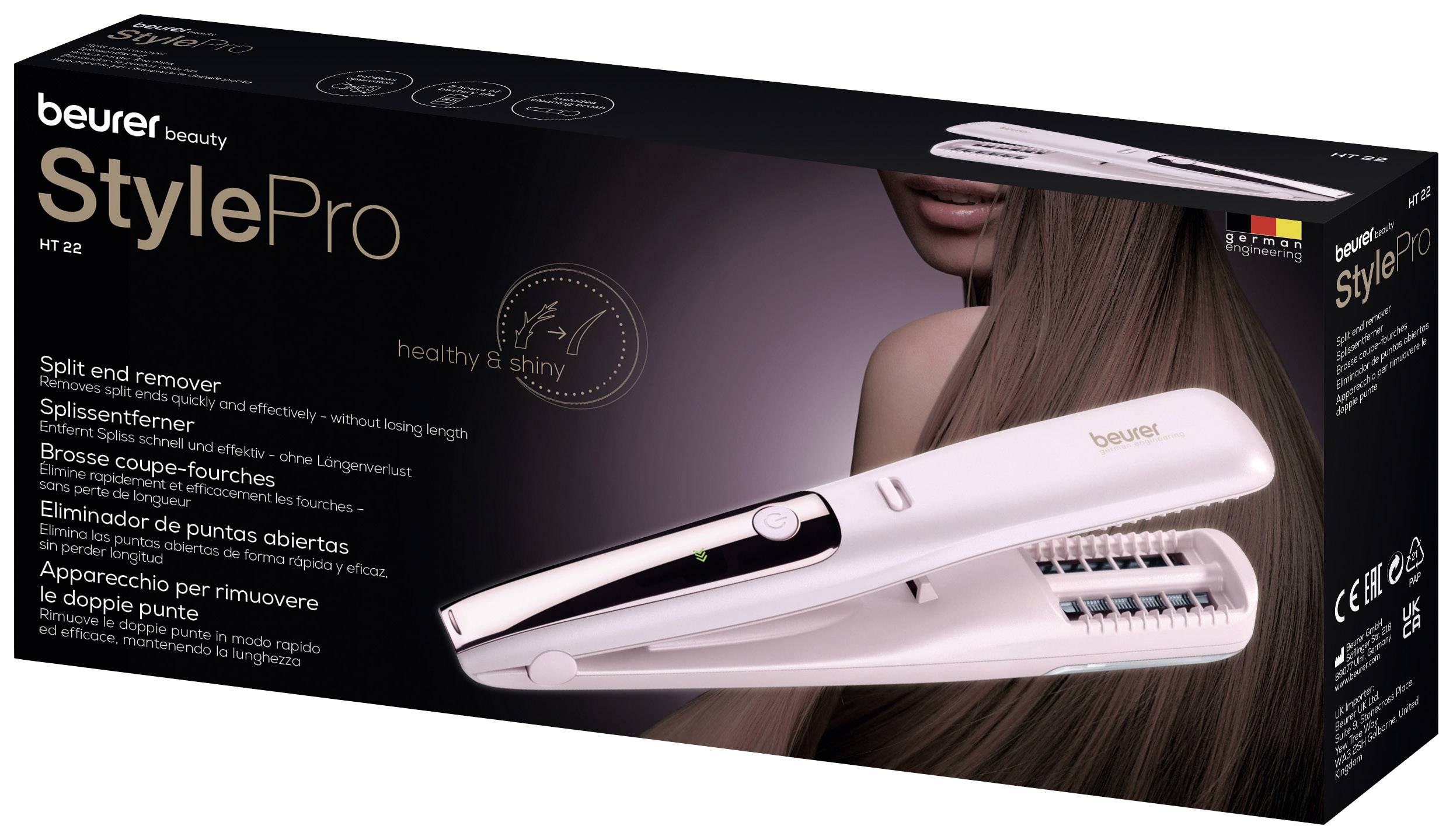 Beurer StylePro HT 22 Doos. Bevat een apparaat voor het verwijderen van gespleten haarpunten, afgebeeld op een foto met lang, gezond haar.