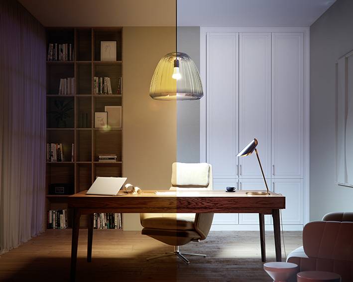 De afbeelding toont een modern kantoor, verdeeld in twee helften met verschillende verlichting: links warm, rechts koel. Een bureau met lamp en stoel is centraal gepositioneerd.