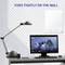 Een bureau met lamp, computer en smartphone. Aan de muur een spiegel met de tekst 'Stevig bevestigd aan de muur'.
