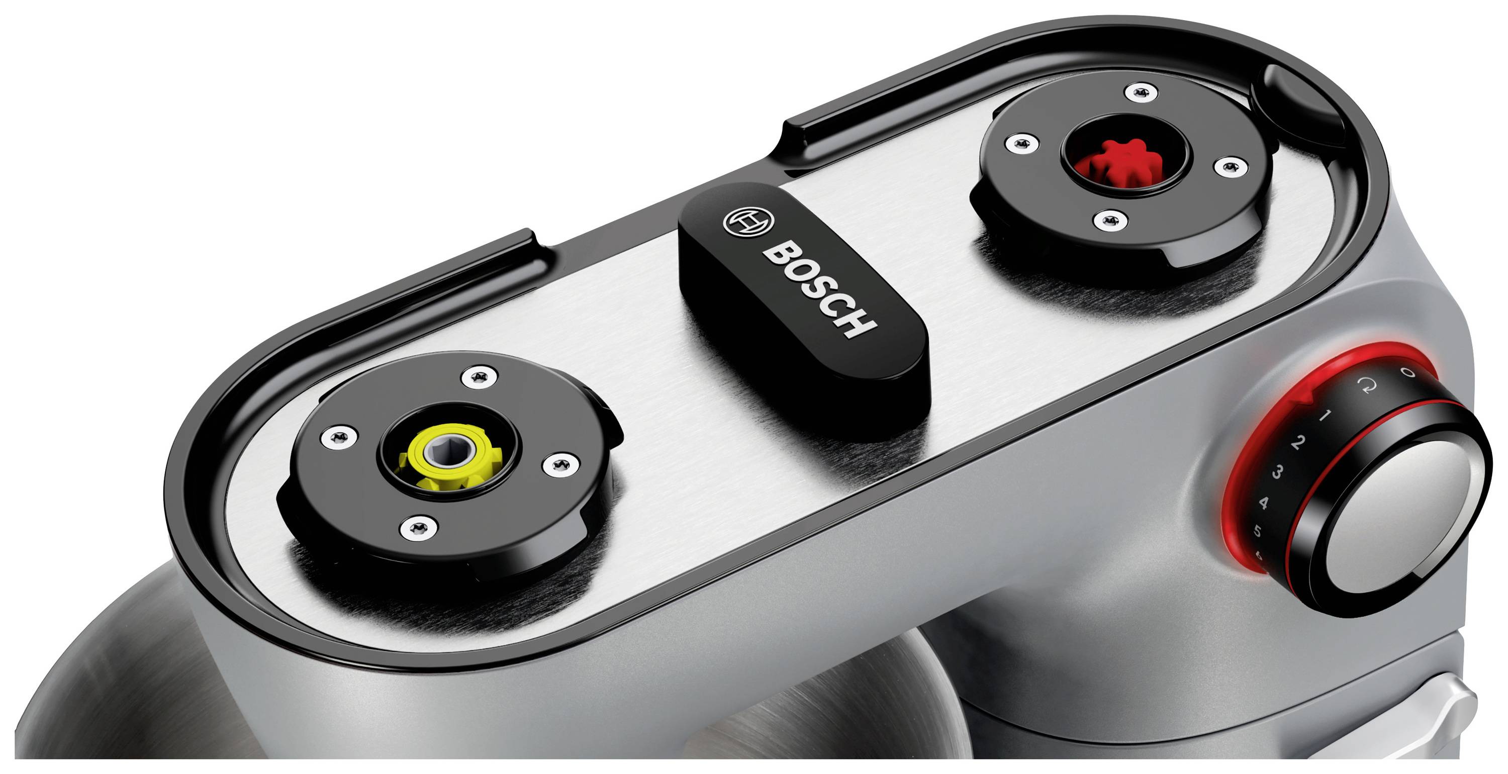De afbeelding toont het bovenaanzicht van een Bosch keukenmixer met twee opzetstukken voor keukenverwerking en een regelaar met een rood lampje.