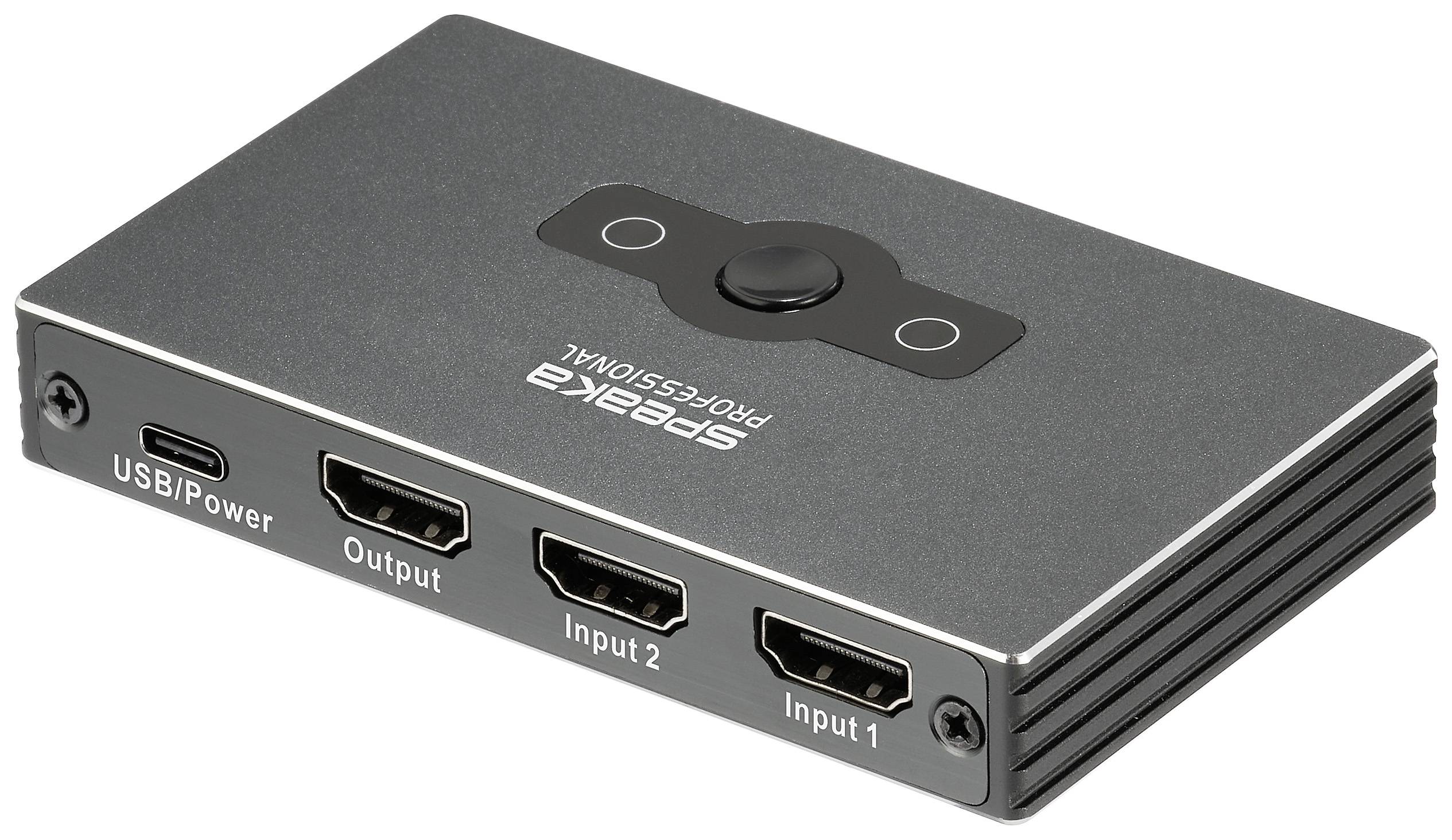 Grijze HDMI-splitter met drie aansluitingen: USB/Power, Output, Input 1, Input 2. Centrale knop voor bediening.