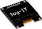 Een klein OLED-display toont de tekst 'Joy-IT'. Bovenaan zijn verbindingspinnen zichtbaar.