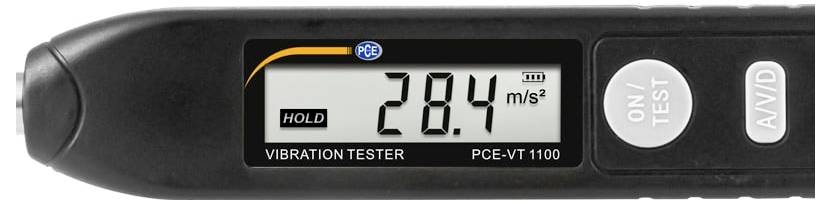 Handgeheven trillingstester display met aanduiding van 28,4 m/s², met HOLD-status en ON/TEST- en AV/D-knoppen.