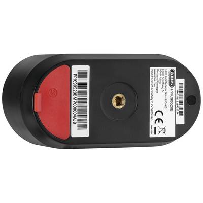 Onderkant van een zwart, rechthoekig elektronisch apparaat met rode en zwarte stickers en technische specificaties.