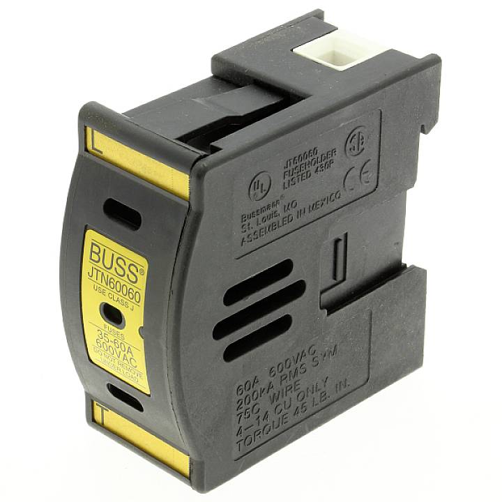 Een zwarte elektrische zekering met een geel etiket waarop 'BUSS' staat. Hij is ontworpen voor 30 ampère en 600 volt, geproduceerd in Mexico.