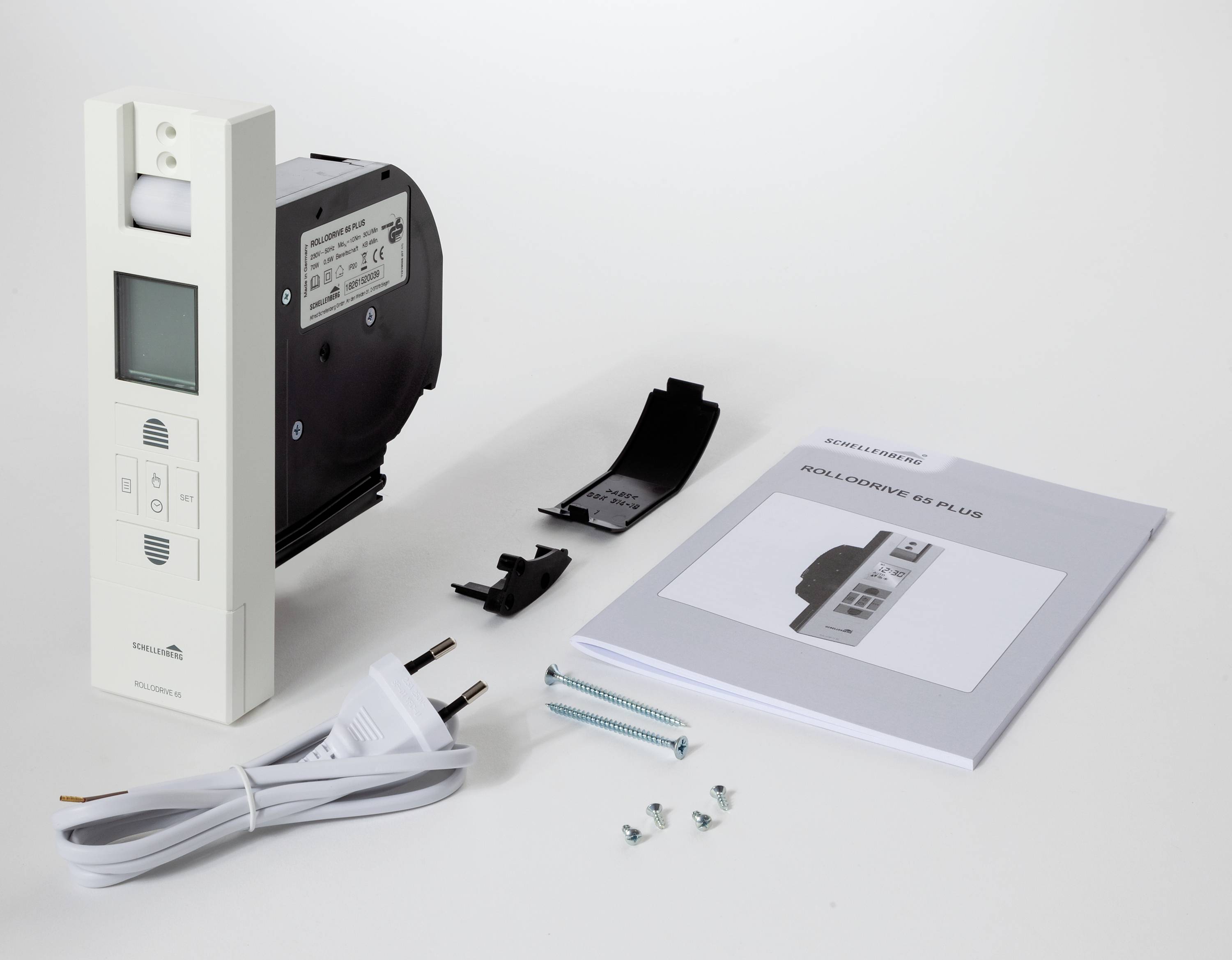 Een digitaal meetapparaat met toebehoren: netsnoer, montageonderdelen en gebruikershandleiding. De gebruiksaanwijzing toont het model 'KONTA CONNOR 65 PLUS'.
