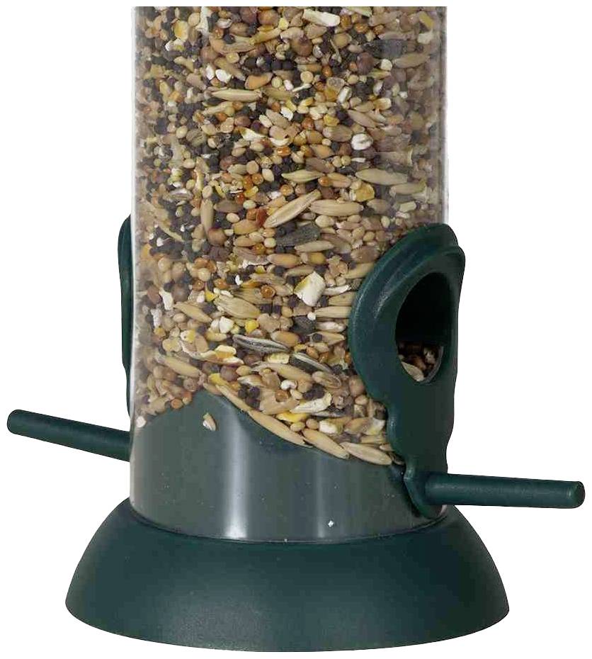 Voederdispenser van groen kunststof, gevuld met verschillende soorten zaden, beschikt over twee zitstokken voor vogels.