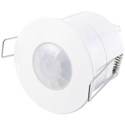Een ronde sensor met metalen bevestigingen, gemonteerd in een witte behuizing. Het gaat om een plafondbeweegmelder.